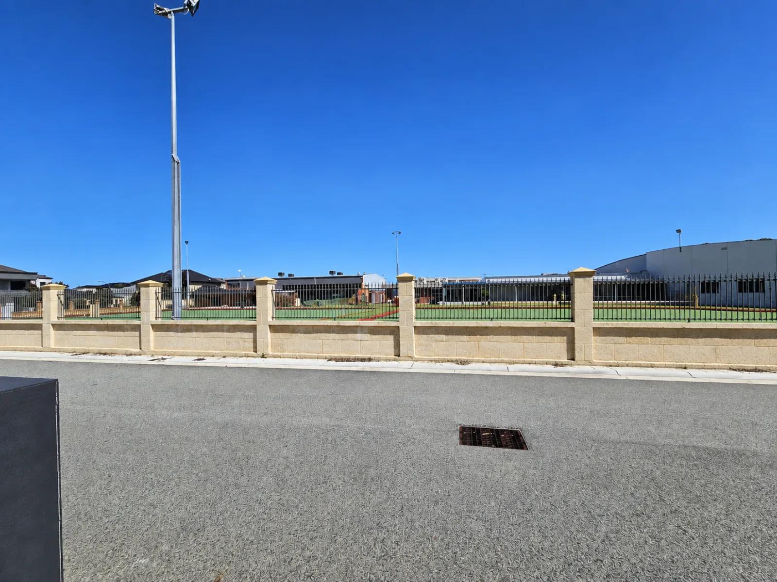 Current ground-level view across Adriatic Lane after parked cars were digitally removed